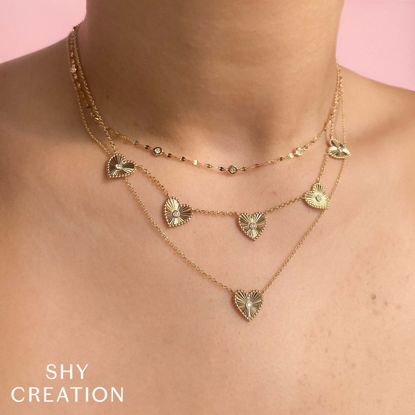 0.09CT 14K Y/G DIAMOND BEZEL RIBBED HEART NECKLACE