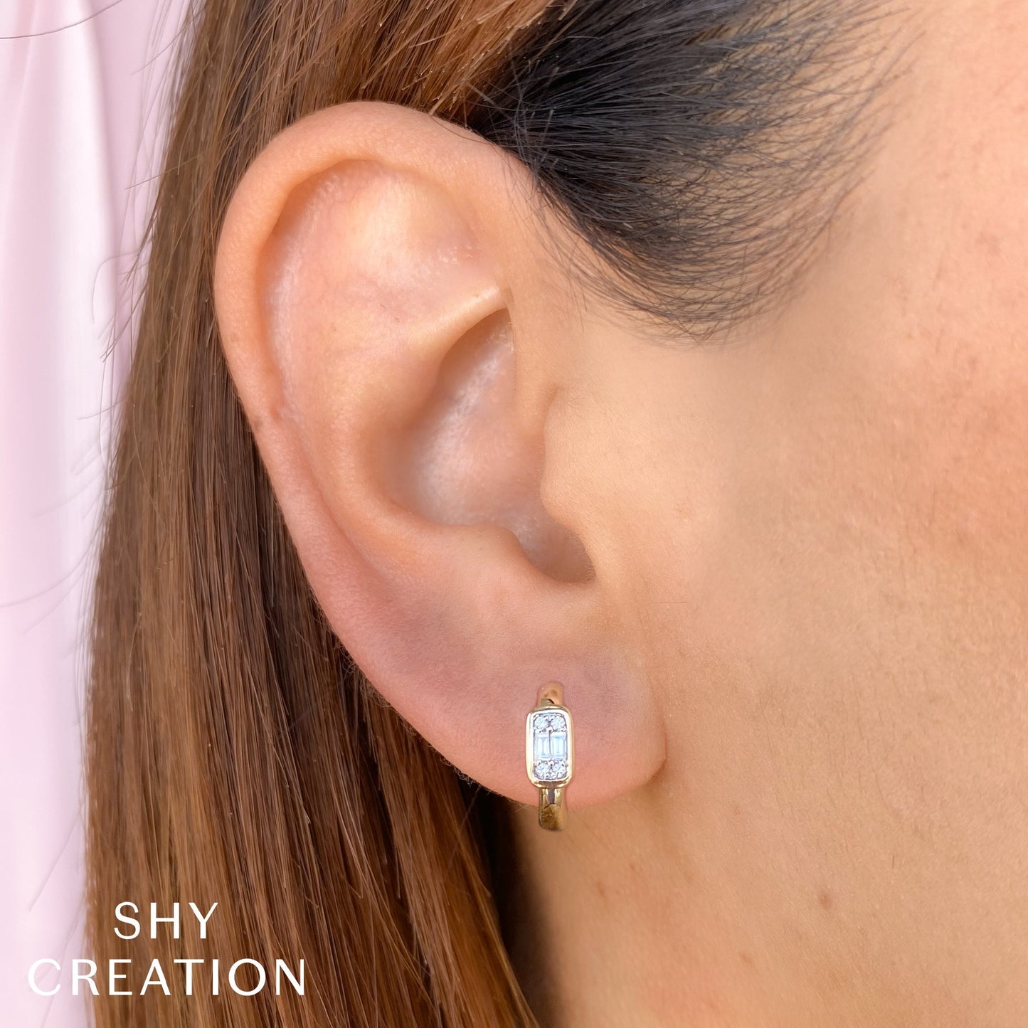 0.14CT 14K Y/G DIAMOND BAGUETTE HUGGIE EARRING