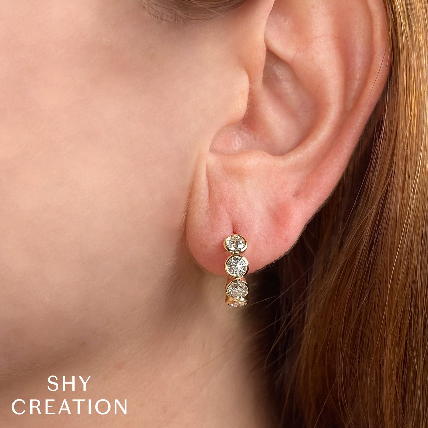 1.50CT 14K Y/G DIAMOND BEZEL HUGGIE EARRING