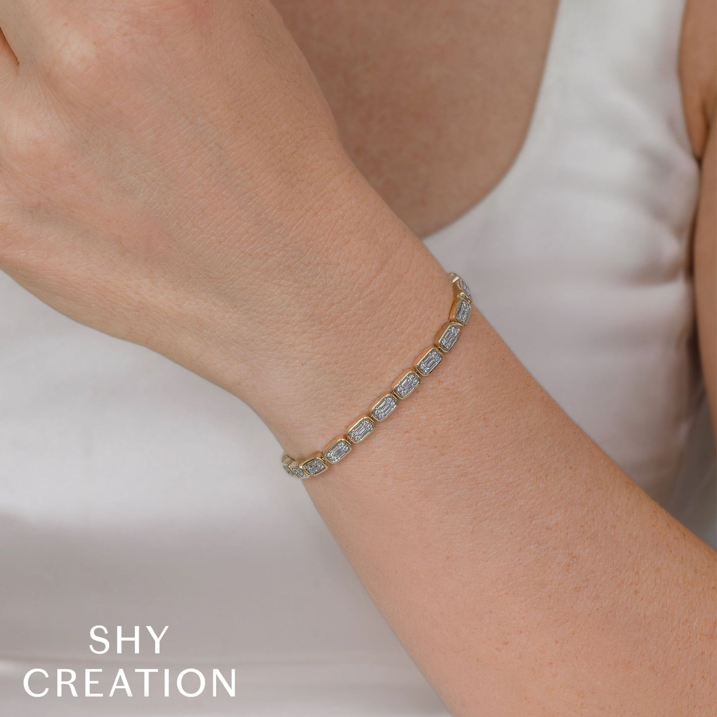 1.53CT 14K Y/G DIAMOND BAGUETTE TENNIS BRACELET